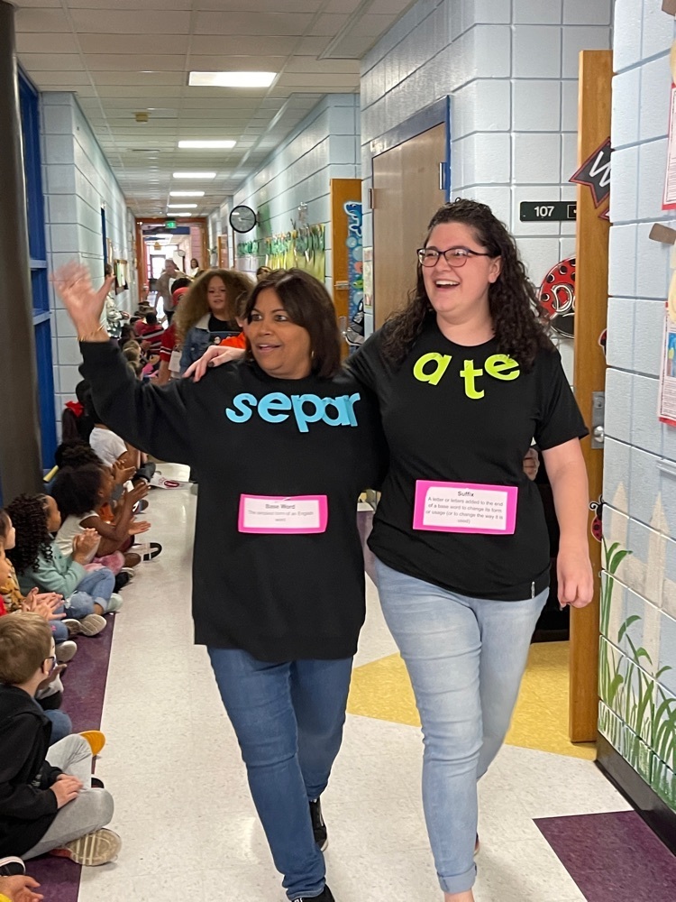 Vocabulary Parade  teachers walk down the hallway