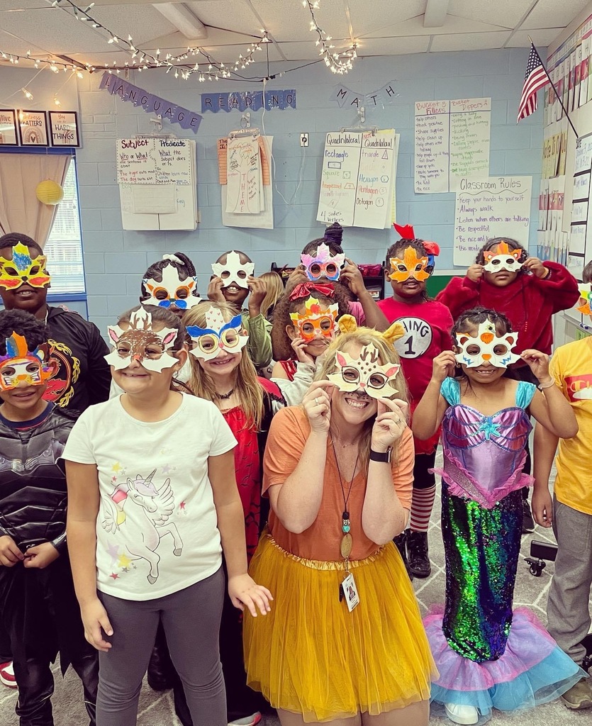Students and teacher wearing masks